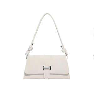 Minimalist beige rectangular crossbody bag with premium leather texture and metal buckle