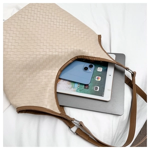 Detailed top view of a large woven tote bag showing spacious capacity for laptops