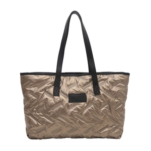 Metallic gold quilted tote bag with large capacity and wavy stitching pattern