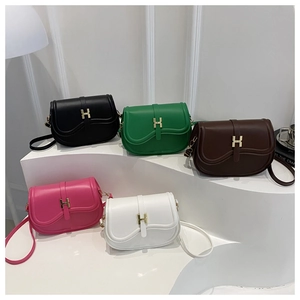 Collection of saddle bags in five colors with iconic golden H clasp and leather straps