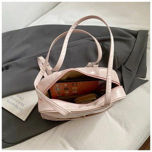 Pink patent leather tote bag interior showing capacity for tablet and daily essentials