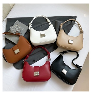 Detail showing five colors of textured hobo bags with unique knot handles and metal buckles