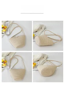 Detail view of beige woven bucket bag with pearl closure and slim shoulder strap