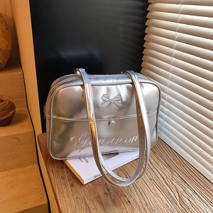 Silver metallic tote bag with bow detail and Ganunon embroidery in a JK style