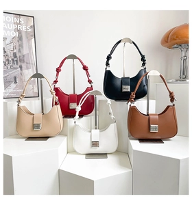 Detailed collection of colorful leather hobo bags with woven knot handles and silver metal logo