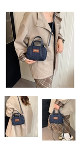 Detailed views of dark blue denim crossbody bag with contrast stitching and leather patch