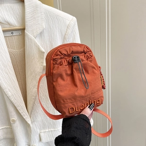 Orange nylon drawstring crossbody mini bag with fashion embroidery for women