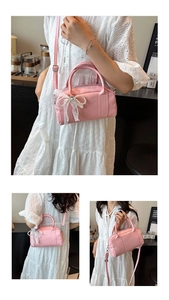 Detailed view of pink Boston bag showing pearl bow lace charm and versatile strap options