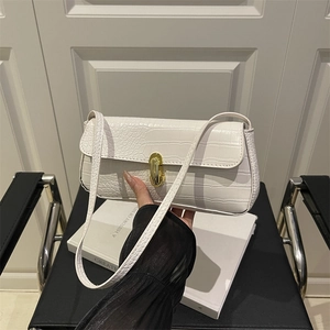 White crocodile pattern underarm bag with gold clasp and elegant vintage shoulder strap