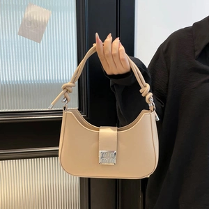 Minimalist nude hobo shoulder bag with knot handle and engraved silver metal buckle
