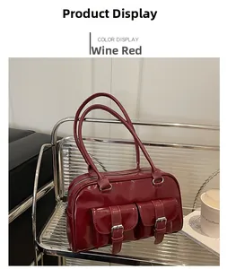 Detail of burgundy retro bowling bag with glossy finish and decorative pockets