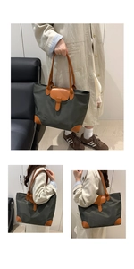Dettaglio di una grande borsa tote in nylon oliva con manici in pelle marrone per ufficio