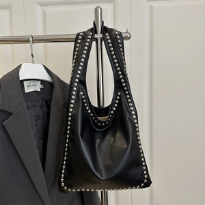 Retro black leather hobo bag with silver metallic rivets and soft pleated texture