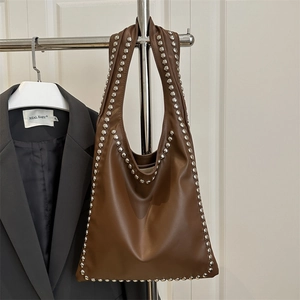 Large dark brown faux leather tote bag with silver rivet studs for daily shoulder wear
