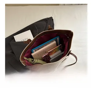Top view of large canvas tote bag showing spacious interior with burgundy lining