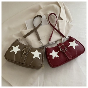 Detail of trendy star shoulder bags with litchi texture and metal star buckles