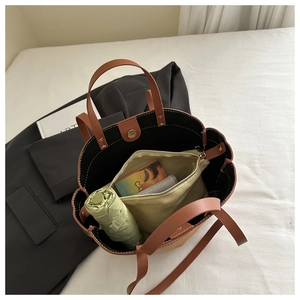 Interior view showing the large capacity and canvas inner pocket of the leather tote bag