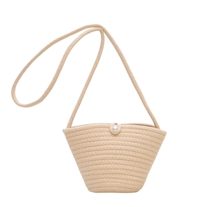 Beige knit bucket bag with pearl closure and shoulder strap in minimalist summer style