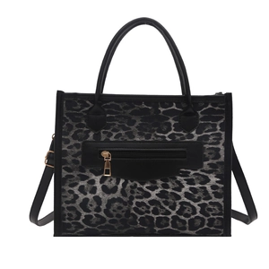 Fashionable leopard print small square tote bag with gold zipper and black leather trim
