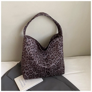 Detail of grey leopard print tote bag with large capacity and stylish retro fabric texture