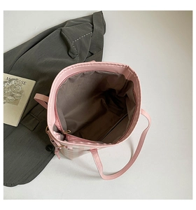 Top view showing the large capacity interior with zip pocket of the pink plaid tote bag