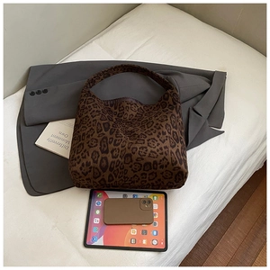 Top view of large leopard print tote bag showing spacious capacity for tablets and phones