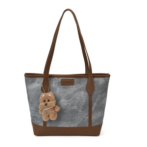 Gray marble-textured canvas tote bag with brown leather handles and plush bear charm