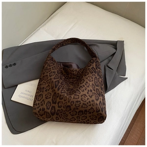 Close-up of leopard print tote bag texture and soft silk lining for autumn style