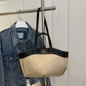 Minimalist beige and black two-tone boat-shaped tote bag with large capacity