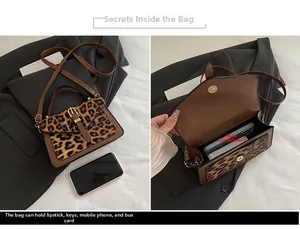 Detail view of leopard print crossbody bag showing interior capacity for essentials