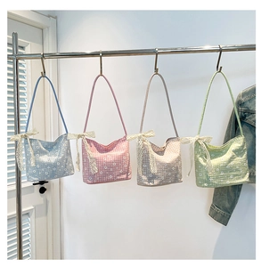 Detail of floral canvas tote bags with daisy prints and white lace bow knots on straps
