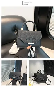 Detail showing shiny black sequin patchwork and matte T-shaped metal buckle on the handbag