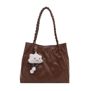 Minimalist coffee brown faux leather underarm bag with cute cloud charm on white background