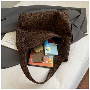 Spacious leopard print tote bag interior showing capacity for tablet and accessories