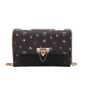Mini black crossbody chain bag with pink floral print and golden metal lock hardware