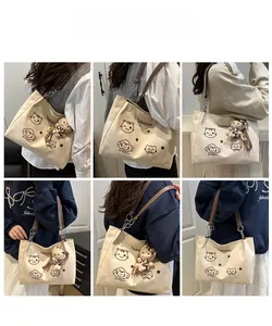 Collage of beige canvas tote with cartoon cat prints and brown leather shoulder straps