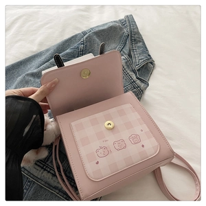 Pink PU leather crossbody bag with plaid front pocket and cute bear illustration