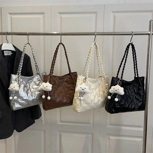 Large embossed tote bag with bear patterns and woven handles in four colors