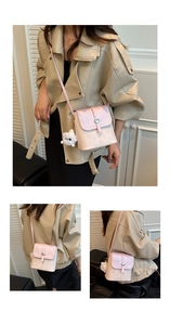 Detail of pink crossbody bag with silver heart buckle and cute cat print design