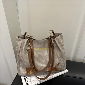 Sac fourre-tout en toile grise avec anses en cuir marron et lettrage vintage