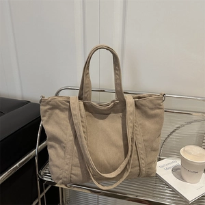 Corduroy tote bag in khaki with vertical stripes, dual handles and long shoulder strap