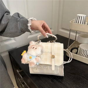 Plaid cream mini backpack for women featuring a cute teddy bear charm accessory