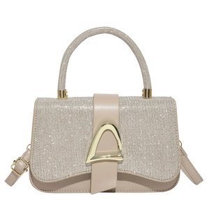 Elegant beige crossbody bag with sparkling finish and golden D-buckle detail