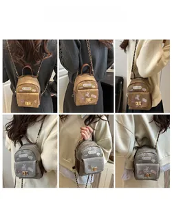 Mini crossbody bag with cartoon bear patches and metal chain strap in retro brown and grey