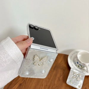Elegant Galaxy Z Flip case with sparkling rhinestone butterfly and pearl decorations