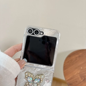 Detail of silver phone case with a large rhinestone butterfly for Samsung Z Flip