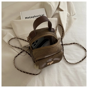 Top view of vintage canvas backpack interior with pockets for phone and wallet storage