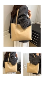 Detail of cream tote bag featuring adjustable metal buckle and fashion text print