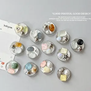 Silver foil heart gemstone and star rhinestone phone socket grips in various colors