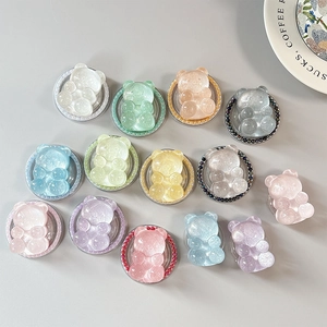 Colorful glitter gummy bear phone sockets with decorative pearl edges and shiny resin finish